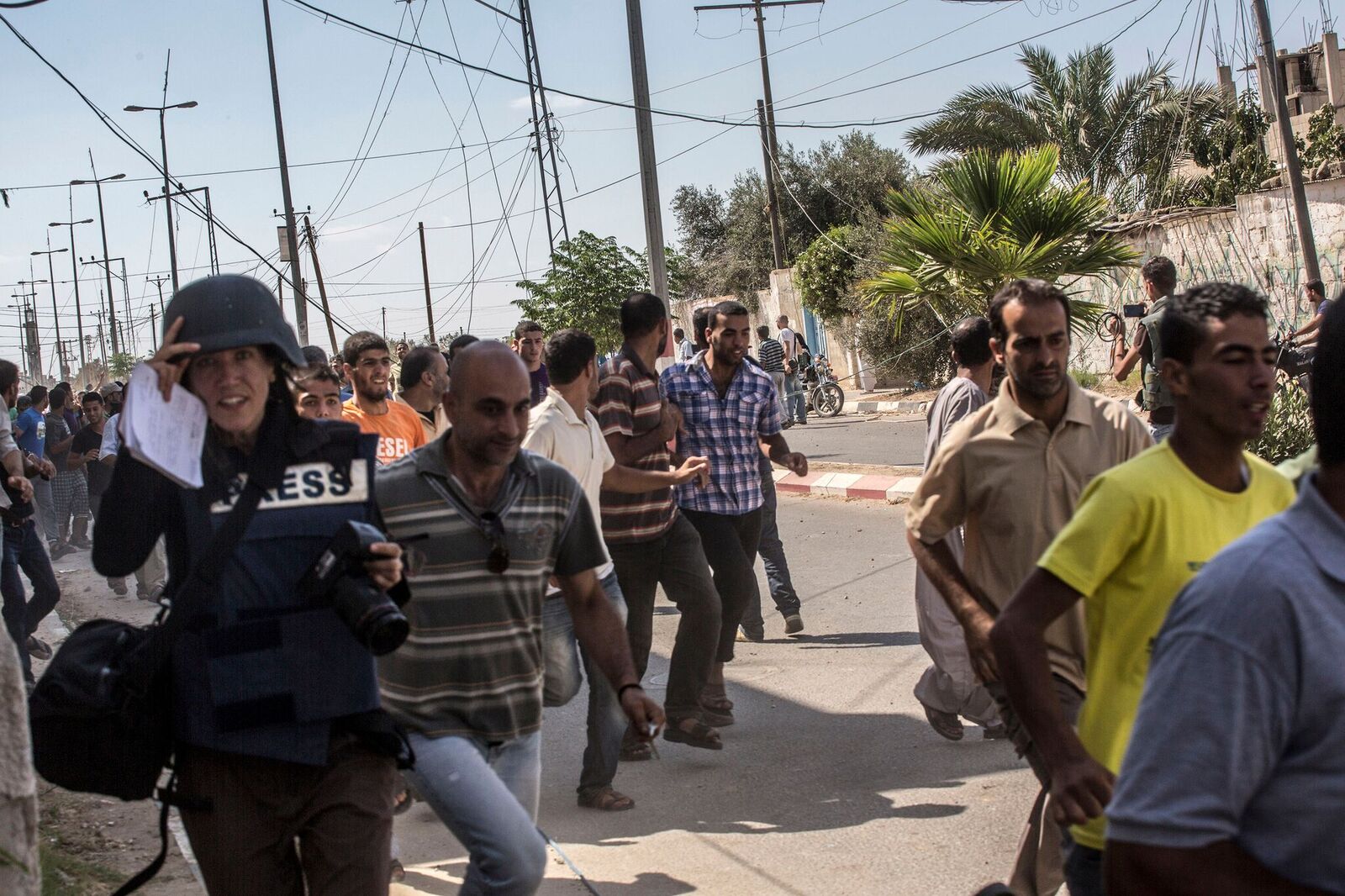 Israeli soldires began to fire. Everyone in the street ran away and so did we.
