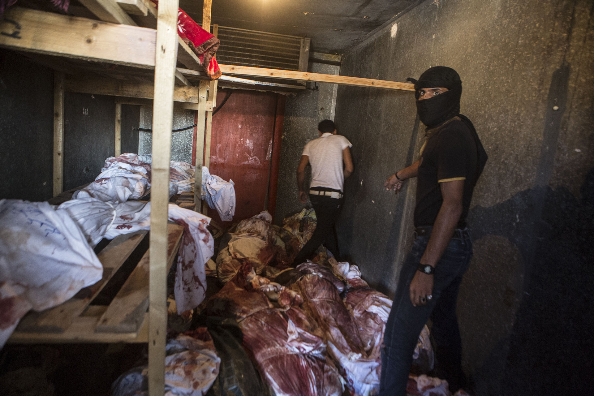 This hut in a remote agricultural area of Rafah houses a walk-in flower cooler turned morgue. It is left over from Gaza's once blooming industry of freshly cut flowers sold for export. This is where the bodies of Iman, Hala and Jana were placed.
